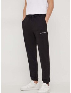 Pamučni donji dio trenirke Calvin Klein Jeans boja: crna, bez uzorka