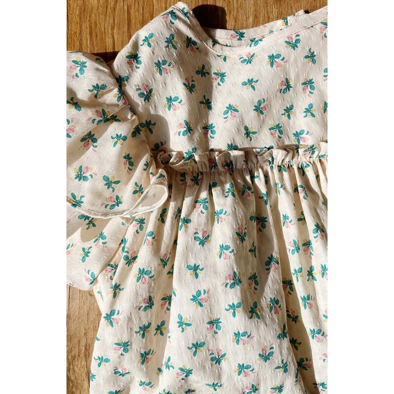 Dječja pamučna haljina Konges Sløjd boja: bež, mini, širi se prema dolje