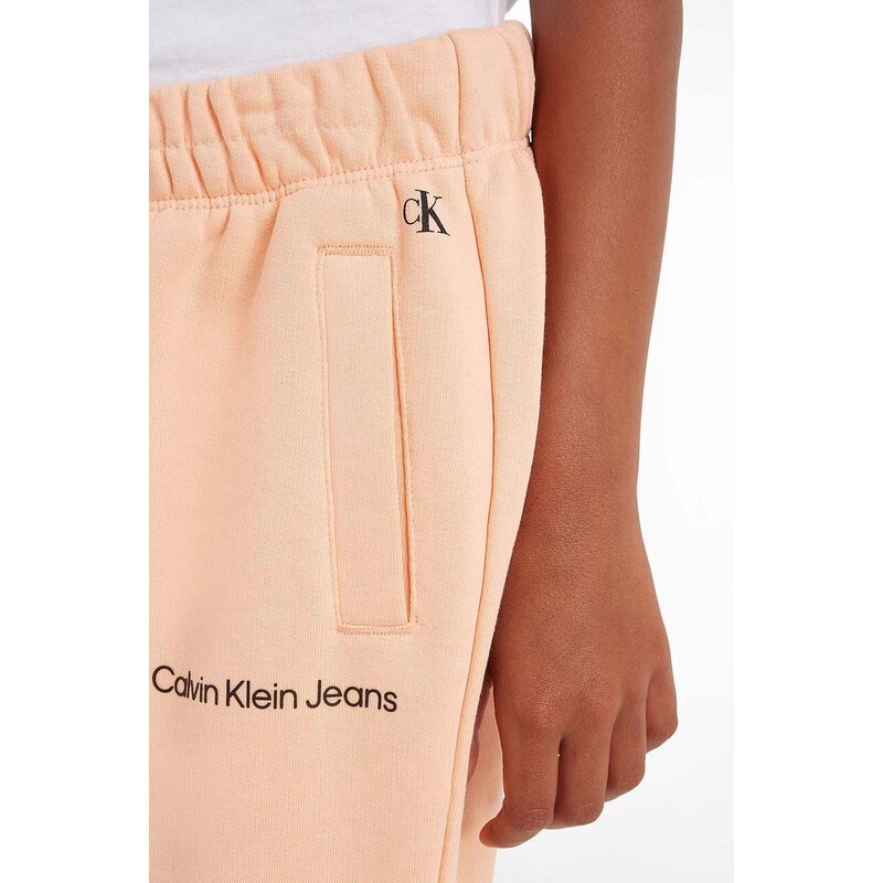 Dječji donji dio trenirke Calvin Klein Jeans boja: narančasta, glatki materijal